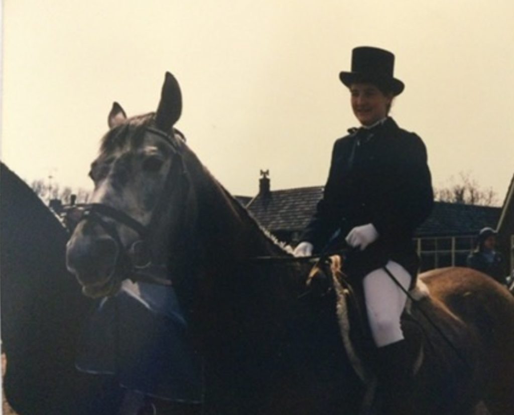 Clara riding her first own horse at a village event after years of riding pony club loan ponies